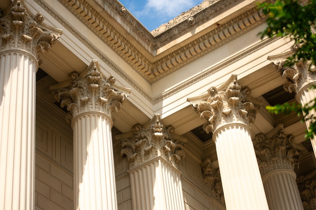 Ornate classical building facade with fluted columns and carved capitals.